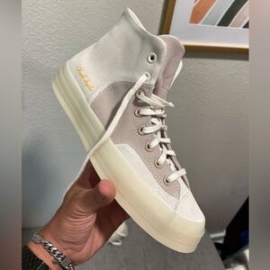 New with tags,  size 9.5.   Never worn, missing box.     Converse Chuck 70 High